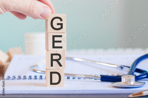 wooden block form the word gerd with stethoscope on the doctor's desktop, medical concept photo