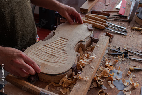 Luthier workshop where violins are building with different tools to work on wood