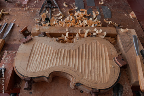 Luthier workshop where violins are building with different tools to work on wood