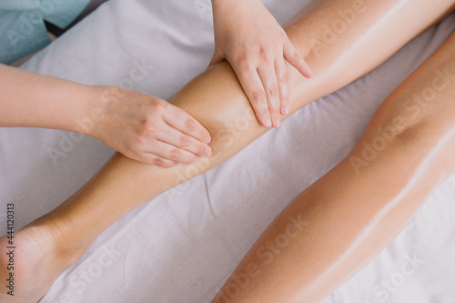 leg massage close-up. Spa salon self-care relax. Kneading foot. Pleasant pleasures. The masseur is working. Health care acupuncture. anti cellulite slimming. beauty and health