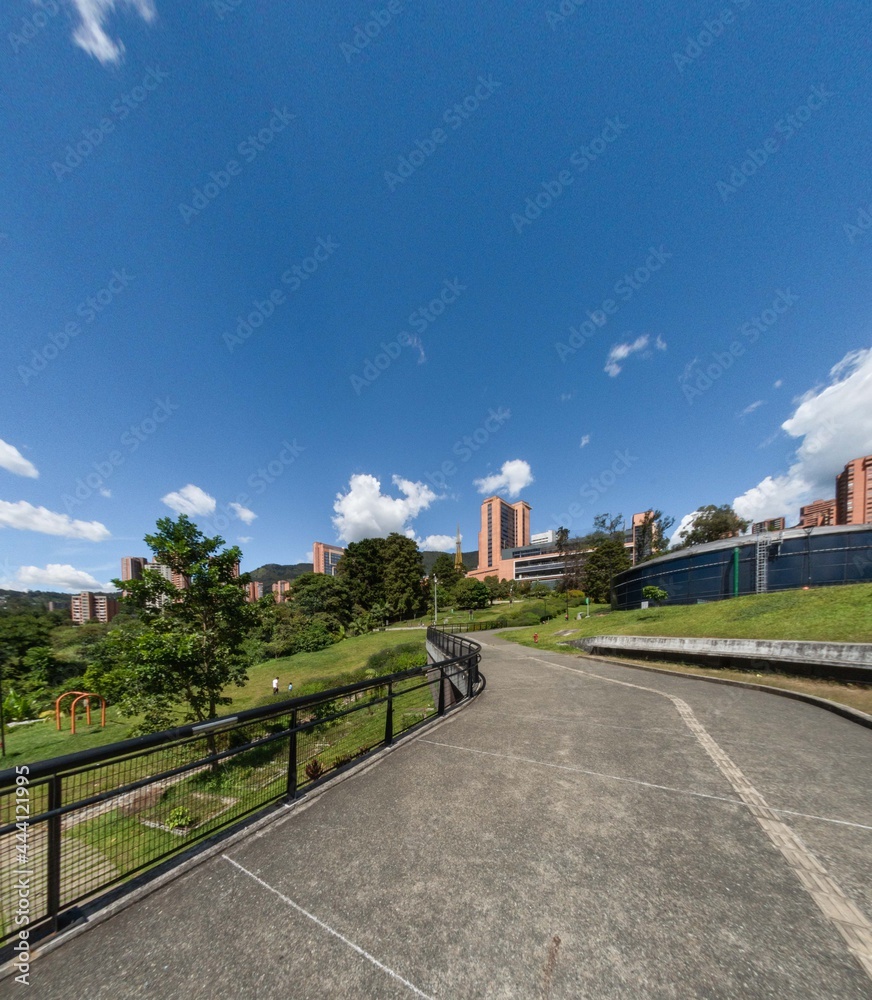 Medellin, Antioquia, Colombia. August 7, 2020: Landscape with blue sky in the Uva La Ilusión park.