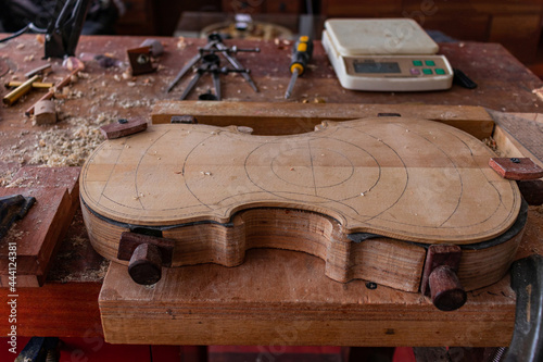 Luthier workshop where violins are building with different tools to work on wood