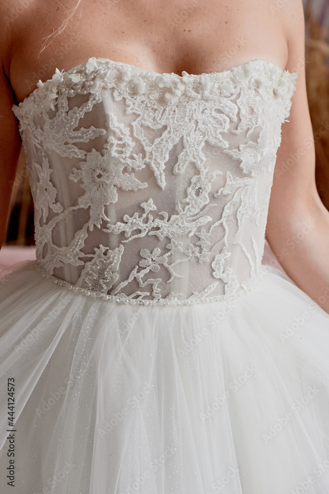 Beautiful woman on a white wedding dress. Wedding morning of a young bride. Without a face. Beautiful woman on a white wedding dress. Wedding morning of a young bride. Without a face.