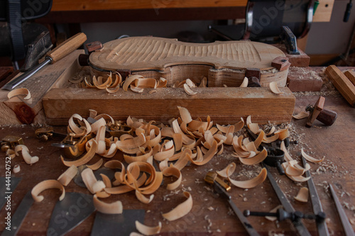 Luthier workshop where violins are building with different tools to work on wood