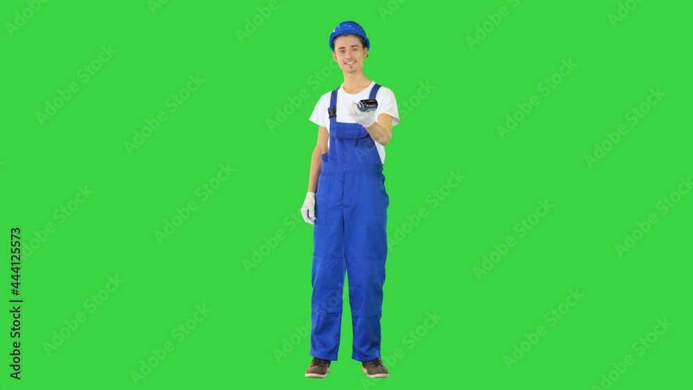 Builder holding bank payment terminal on a Green Screen, Chroma Key. Builder holding bank payment terminal on a Green Screen, Chroma Key.