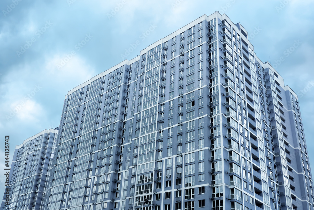 Multistory house. New apartment facade in big building modern flat apartment complex. New house condominium building real estate modern residential architecture. Condo building residential property Multistory house. New apartment facade in big building modern flat apartment complex. New house condominium building real estate modern residential architecture. Condo building residential property