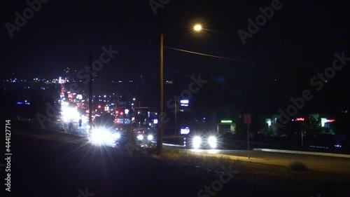 California Illegal Fireworks Used and a Busy Street after a 4th of July, Independence Day, Celebration with Night Traffic on a Main Street photo