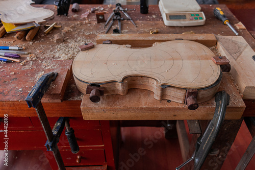 Luthier workshop where violins are building with different tools to work on wood