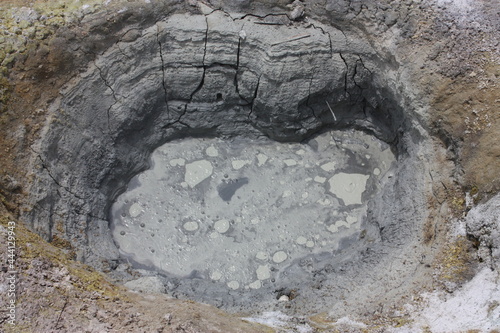 boiling mud pot, in the volcanic area of bumpass hell in lassen national park, in northern california photo