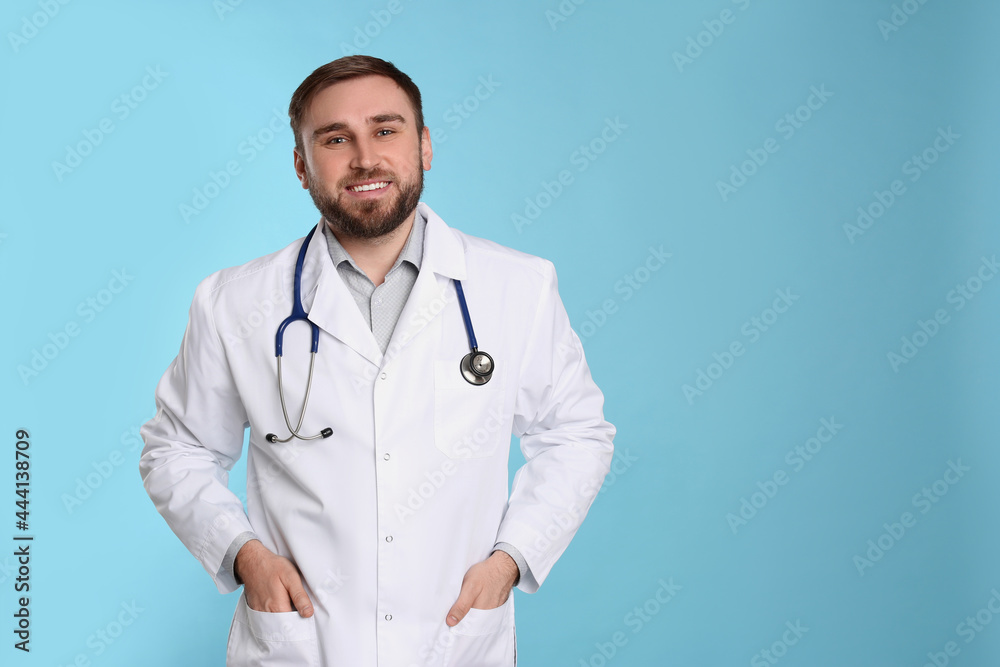 Pediatrician with stethoscope on light blue background, space for text Pediatrician with stethoscope on light blue background, space for text