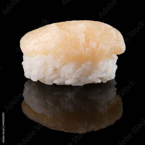 Sushi with scallop on a black background.