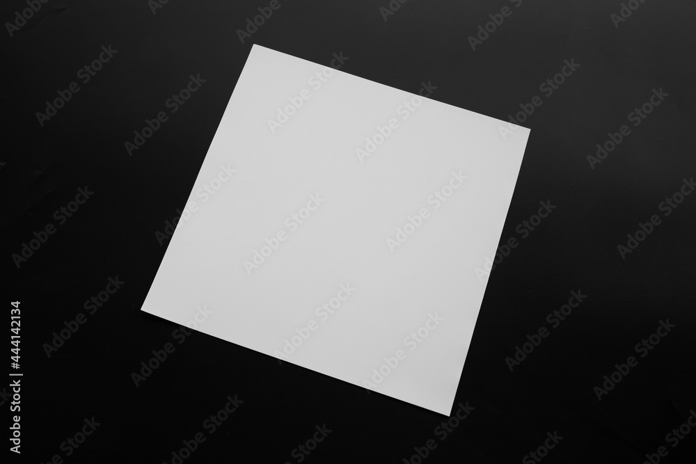 Blank Mock-up paper. brochure magazine isolated on black table, changeable background , white paper isolated on dark tone.