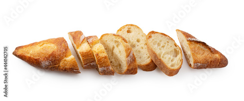 A sliced baguette placed on a white background.