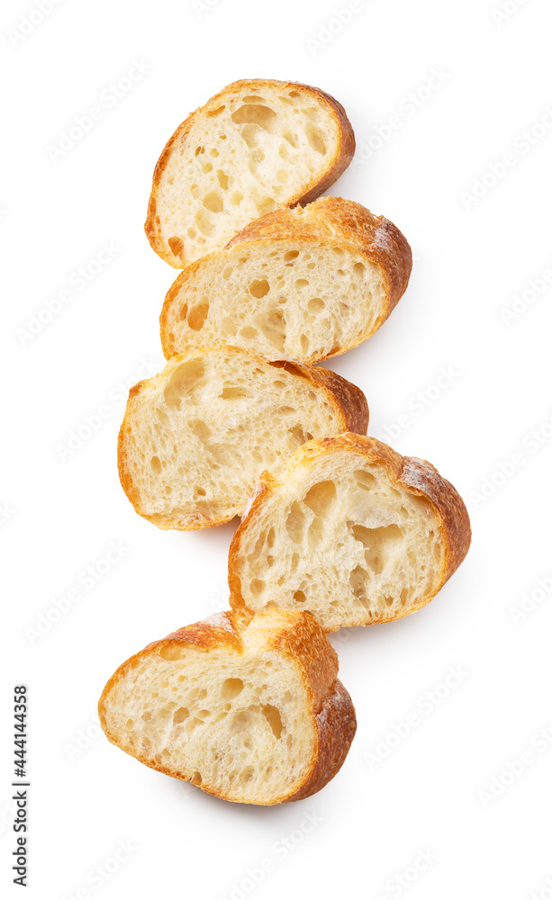 A sliced baguette placed on a white background. A sliced baguette placed on a white background.