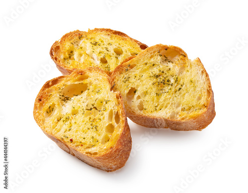 Baked bread with garlic and herbs on a white background.