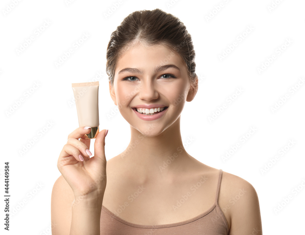 Beautiful girl with tube of foundation on white background Beautiful girl with tube of foundation on white background