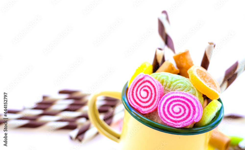 colorful sweets and sugar candies on a white background