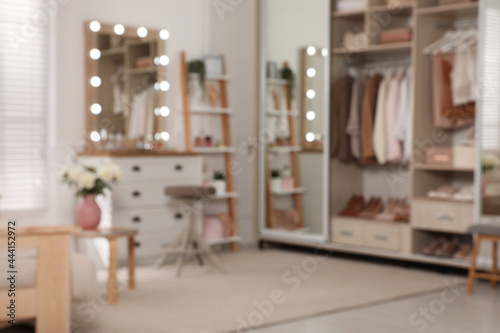 Blurred view of elegant room with dressing table and wardrobe. Interior design © New Africa