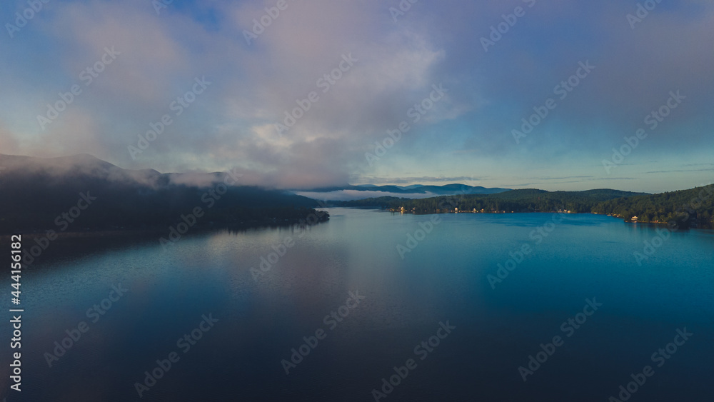 Minutes before sunrise with clouds and fog over the lake Minutes before sunrise with clouds and fog over the lake