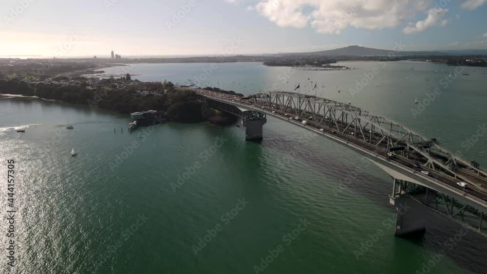 Aerial view of Auckland Harbour Bridge and North Auckland, Rangitoto Volcano in Auckland gulf. Sunny day in New Zealand Aerial view of Auckland Harbour Bridge and North Auckland, Rangitoto Volcano in Auckland gulf. Sunny day in New Zealand