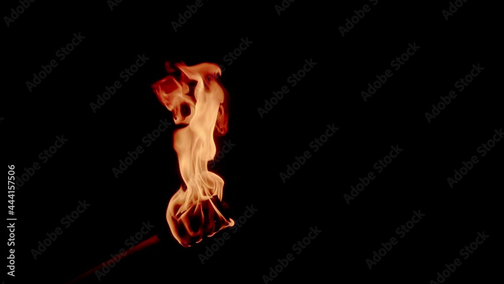 Burning fire torch isolated with black background - campfire concept