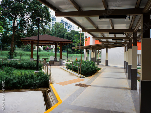 Photography Sheltered walkway path along a HDB void deck in Singapore