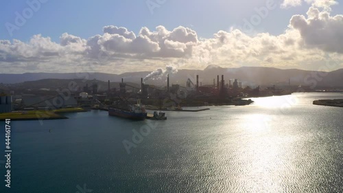 Aerial View Of Port Kembla In Illawarra Region, NSW, Australia With Sunlight Reflection On Blue Sea On A Sunny Morning. photo