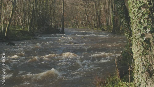 North York Moors, River Esk, Egton Bridge in full flow flood, Late Summer, Autumn time, Slow motion - Clip 9 photo