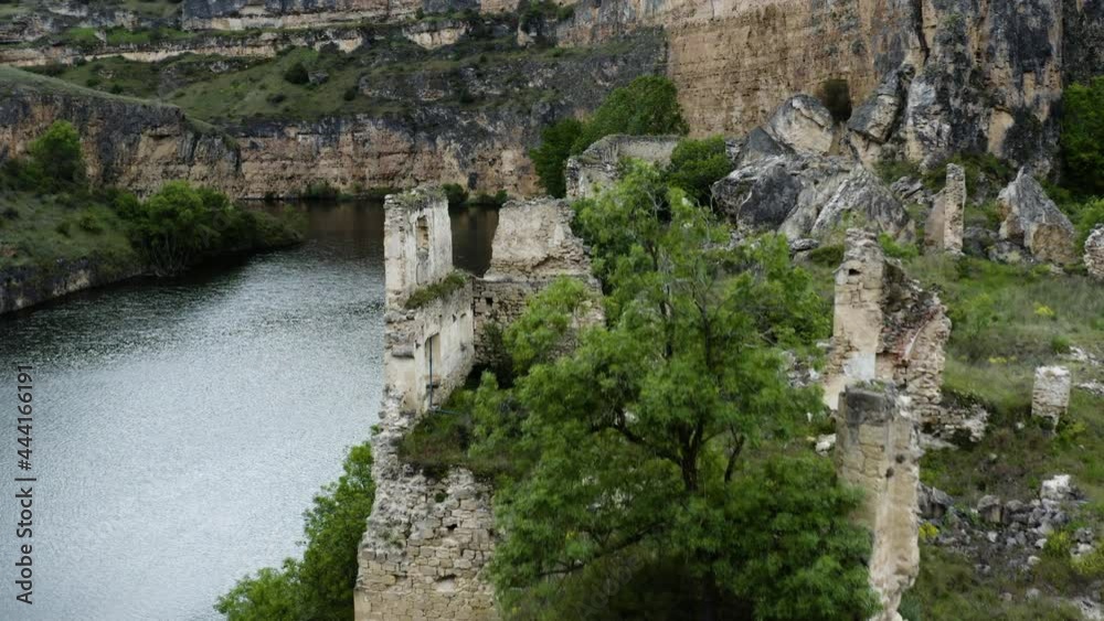 Church Ruins At The Riverbank Of Duraton River In Hoces del Rio Duraton National Park In Spain. aerial Church Ruins At The Riverbank Of Duraton River In Hoces del Rio Duraton National Park In Spain. aerial