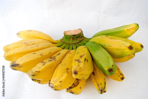 Close-up Photo of Fresh fruit yellow Saba Banana fruit ,  White background isolated. photo