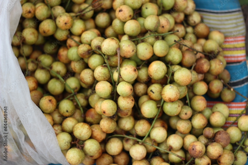 lots of rambai fruit together in a bamboo cage lots of rambai fruit together in a bamboo cage