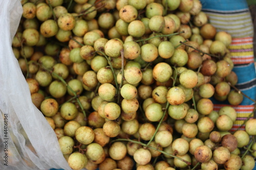 lots of rambai fruit together in a bamboo cage