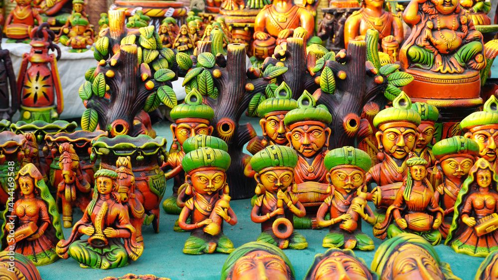 Street shop of handmade statues of Indian idol at rural village annual fair.