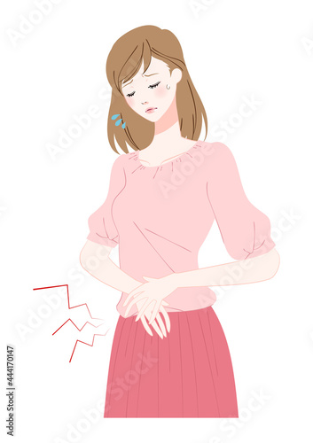 腹痛に苦しむ若い女性