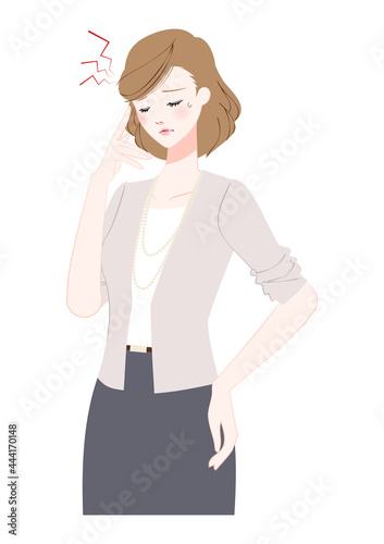 頭痛に悩む働く女性