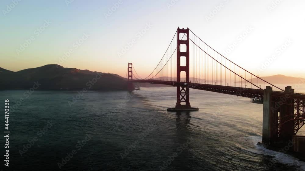 Silhouette of Golden Gate Bridge at Dawn, Drone Aerial View of San Francisco Bay and Landmark on Sunny Morning Silhouette of Golden Gate Bridge at Dawn, Drone Aerial View of San Francisco Bay and Landmark on Sunny Morning