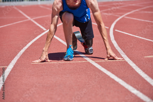 Close up of adaptive sportsman with prosthetic foot ready for jogging