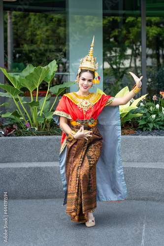 Beautiful Thai girl in traditional dress red dancer costume, identity culture of Thailand. Basic Thai folk dancer of women wearing thai dress dancing lady.