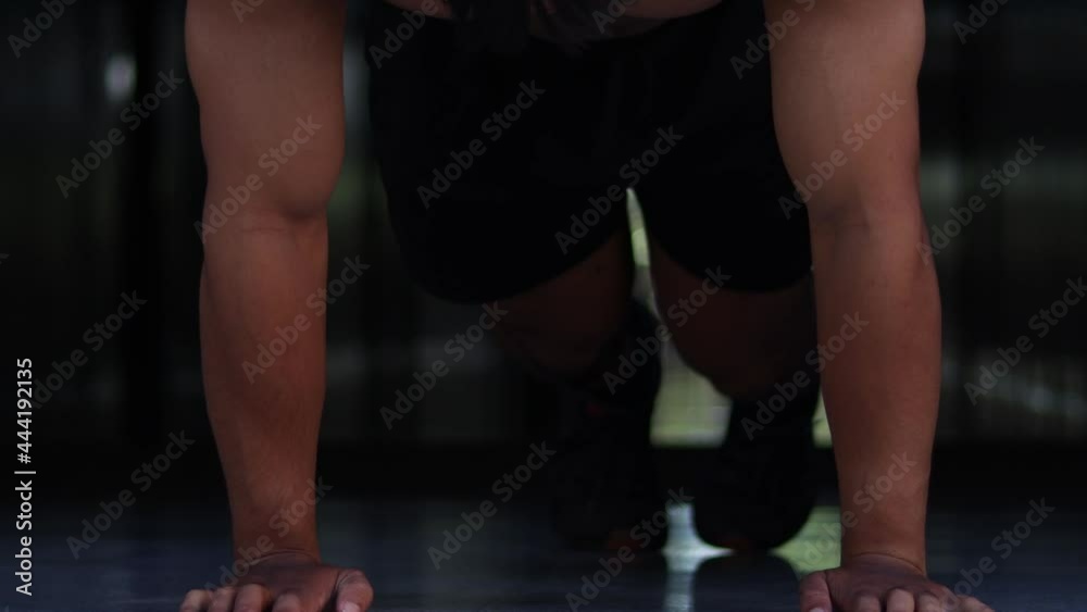 Strong Muscular Athletic Fit Man is Doing Exercises at Home in His Spacious. Strong Muscular Athletic Fit Man is Doing Exercises at Home in His Spacious.