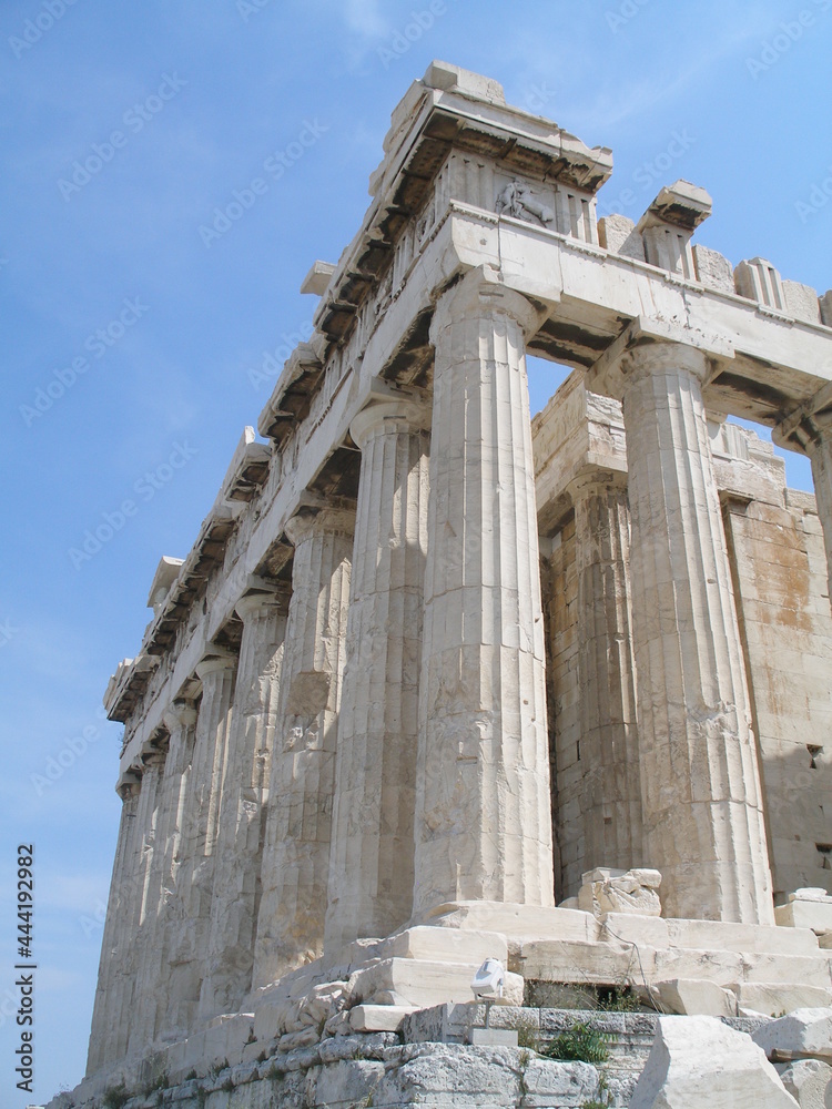the marble columns of the  parthenon, on the acropolis on a sunny day  in athens, greece