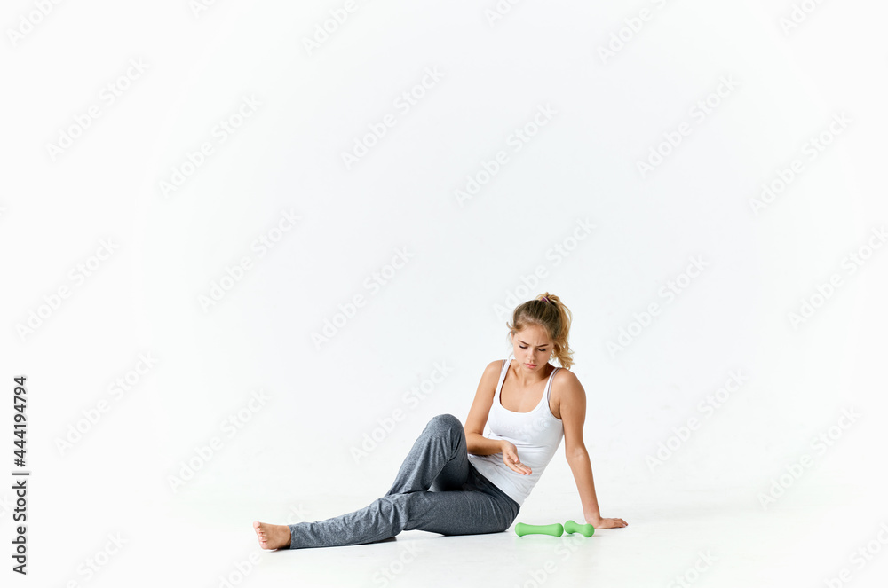 woman sitting on floor with dumbbells workout exercise energy woman sitting on floor with dumbbells workout exercise energy