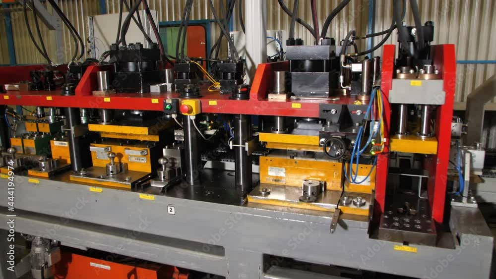 Motion to modern powerful automated machine tool to process materials standing in refrigerator manufacturing plant workshop Motion to modern powerful automated machine tool to process materials standing in refrigerator manufacturing plant workshop