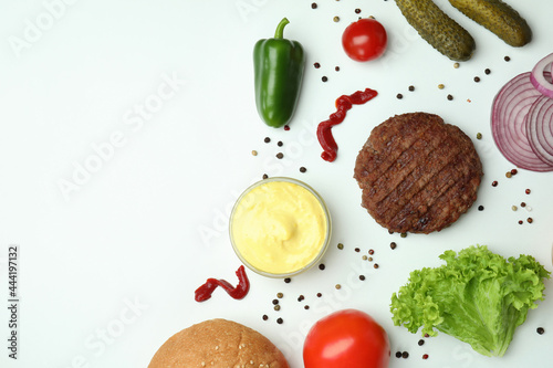 Concept of cooking burger on white background, top view