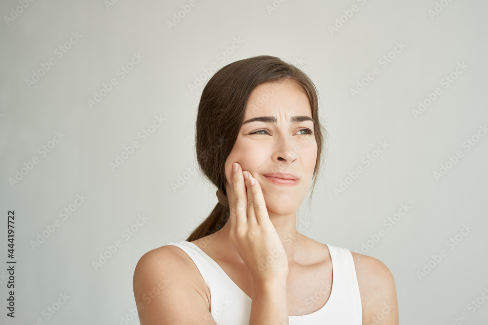 woman holds hand on face teeth pain dentistry medicine discomfort woman holds hand on face teeth pain dentistry medicine discomfort