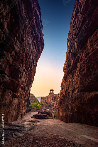 Path through cliffs, Entrance archway for lower and upper Shivalaya in Badami, Karnataka, INDIA.