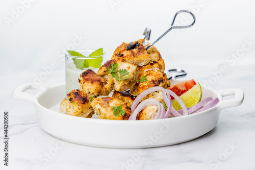 Vászonkép Chicken Tikka served on skewers