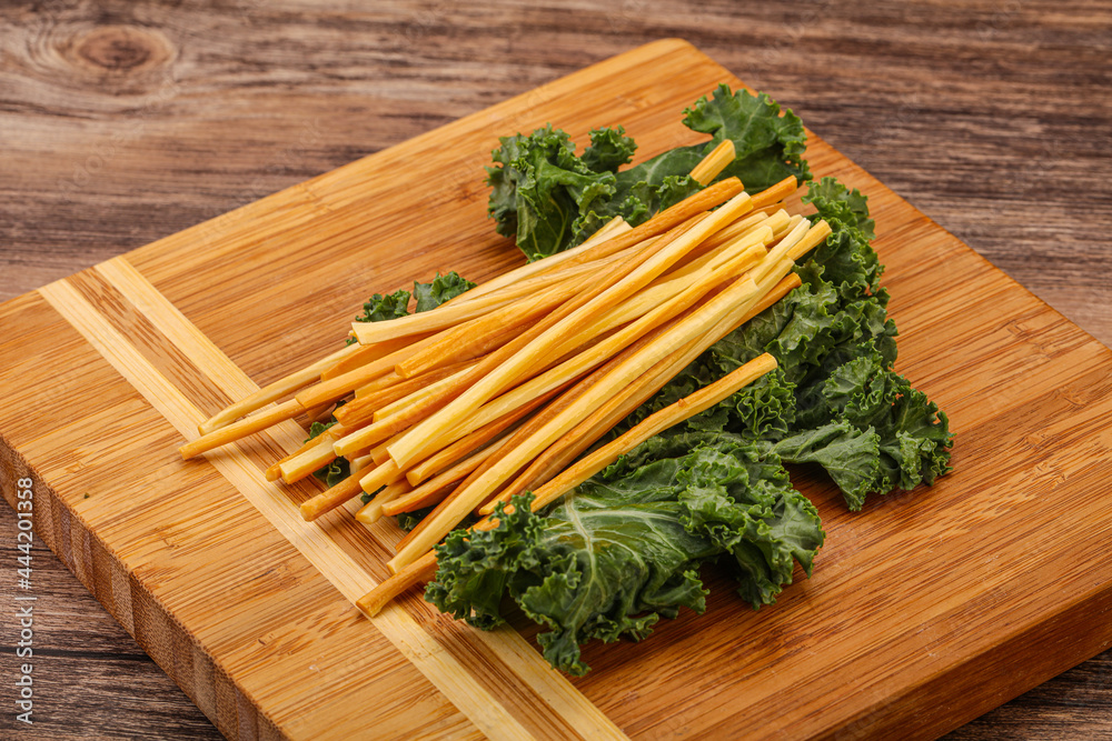 Chechel cheese sticks over board