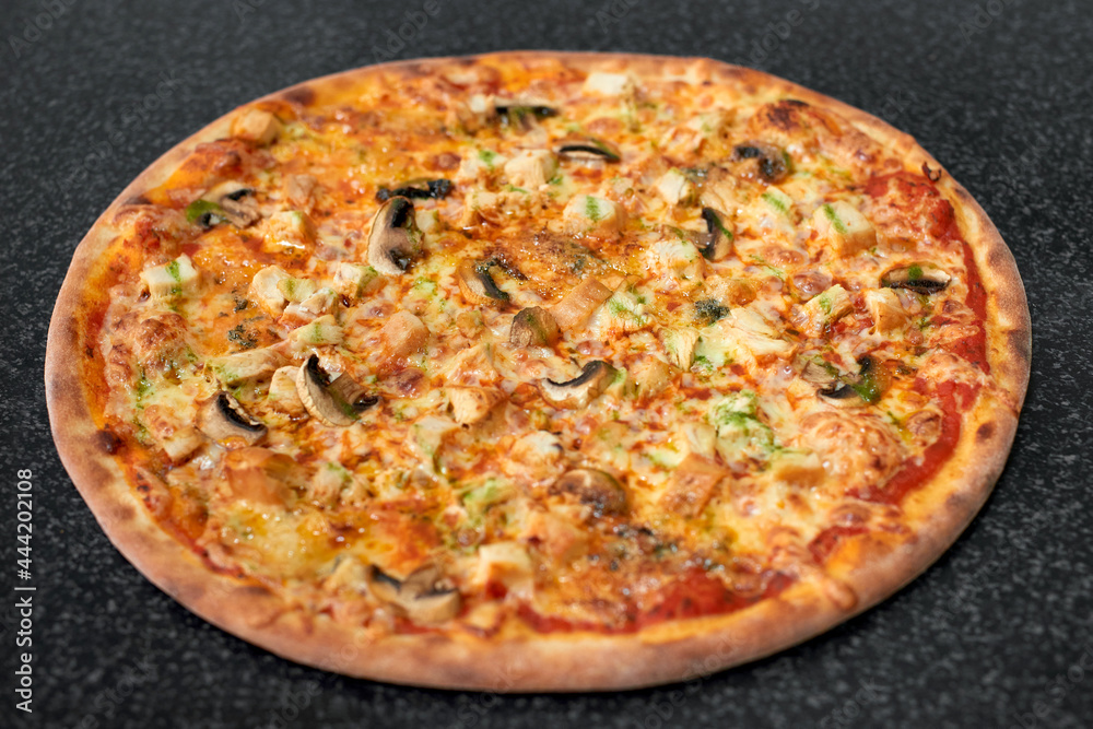 Delicious pizza with chicken, mushrooms and cheese Delicious pizza with chicken, mushrooms and cheese