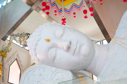 The head of the reclining Buddha, Lokanath Satsada Maha Muni Made from marble from Italy. It is a Buddha image that many Buddhists come to worship. at Udon Thani photo