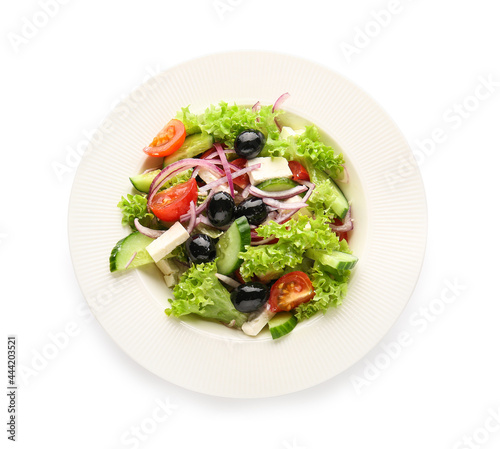 Plate with tasty Greek salad on white background